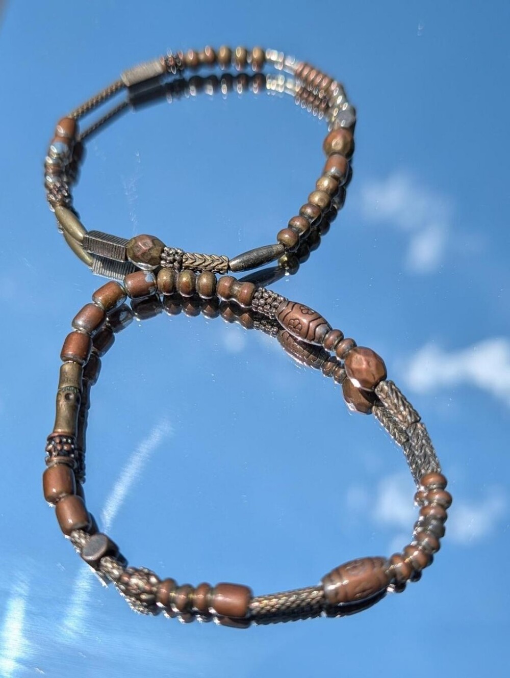 Set of Two Bronze Tone Metal Beaded Elastic Bracelets with Stamped Beads